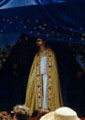 blue robes, gold mask, white christ